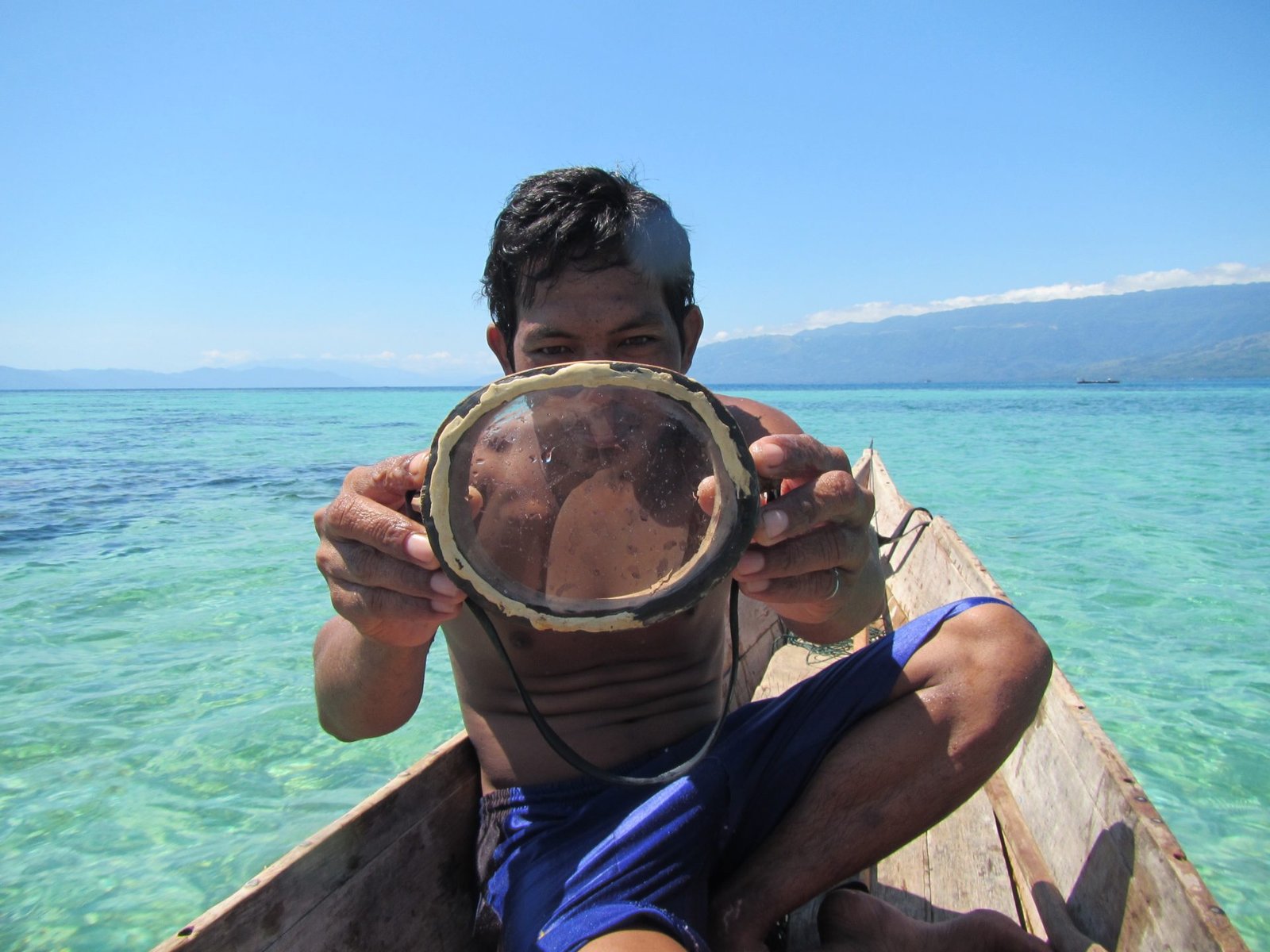 bajau boy on boat